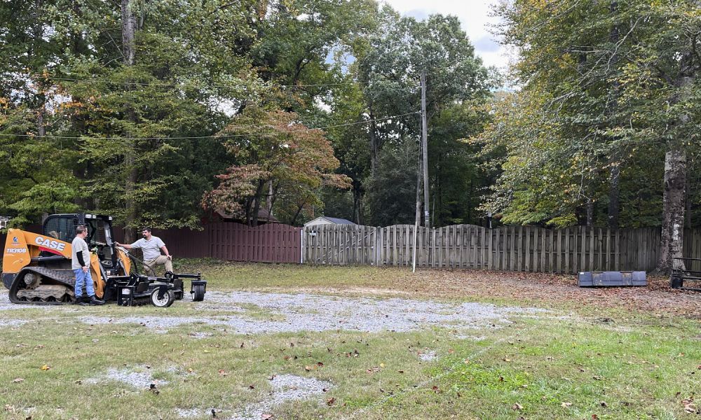 A Wide Angle Shot Of Two Landscape Grading Professionals Discussing On The Site Before The Yard Leveling Process