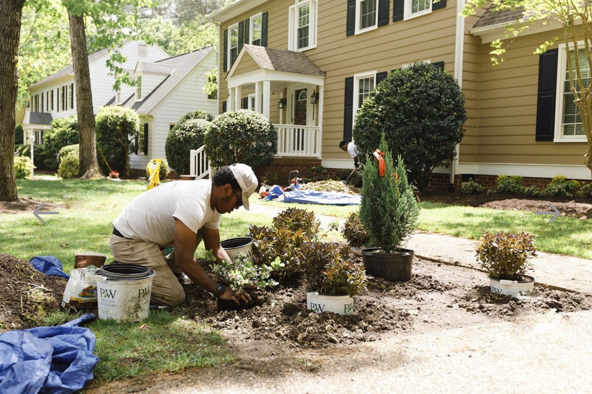 Southern Sun Employee Working On Planting New Flowers